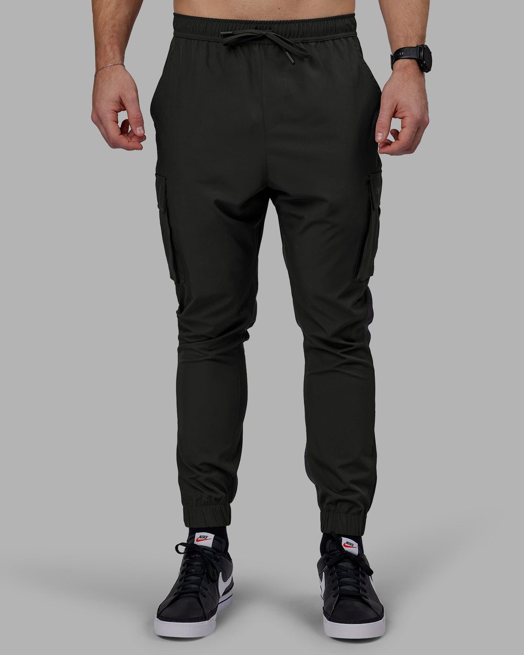 Man wearing Energy Stretch Performance Cargo Joggers - Pirate Black