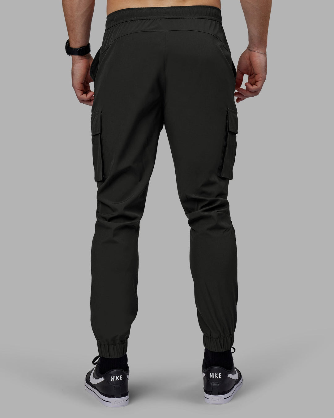 Man wearing Energy Stretch Performance Cargo Joggers - Pirate Black