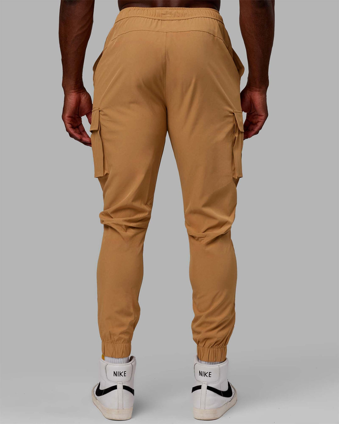 Man wearing Energy Stretch Performance Cargo Joggers - Latte