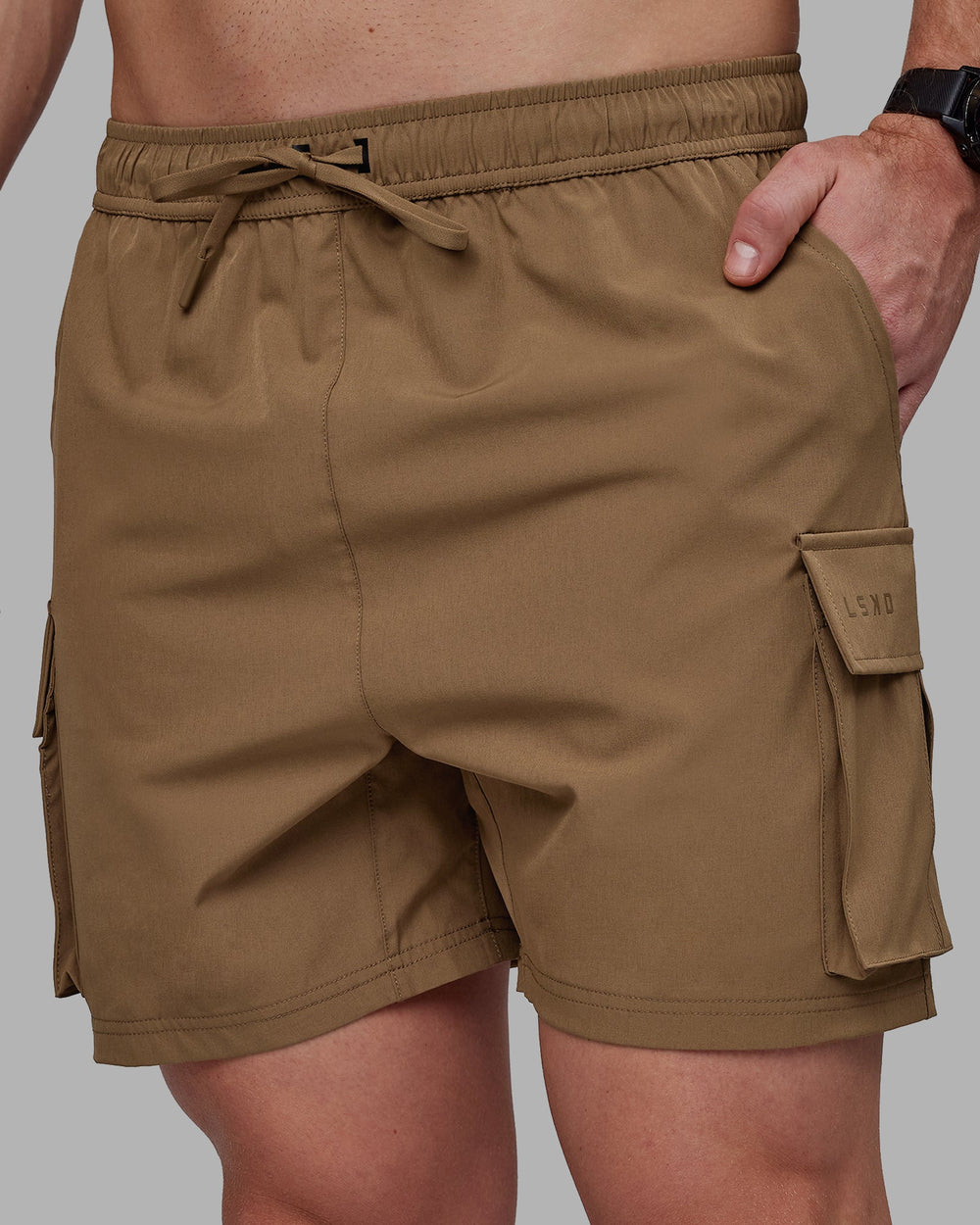 Man wearing Energy Stretch Performance Cargo Shorts - Otter