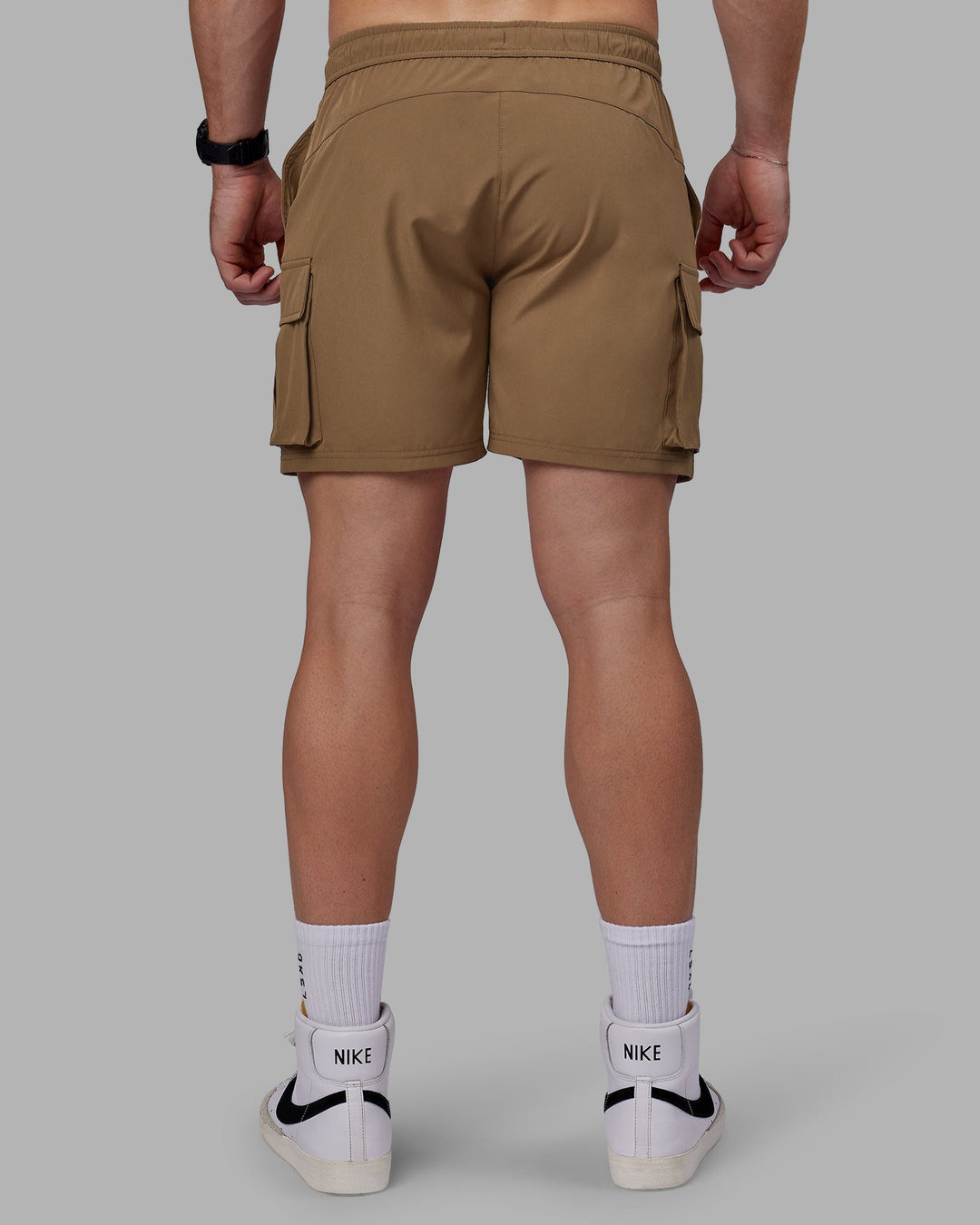 Man wearing Energy Stretch Performance Cargo Shorts - Otter