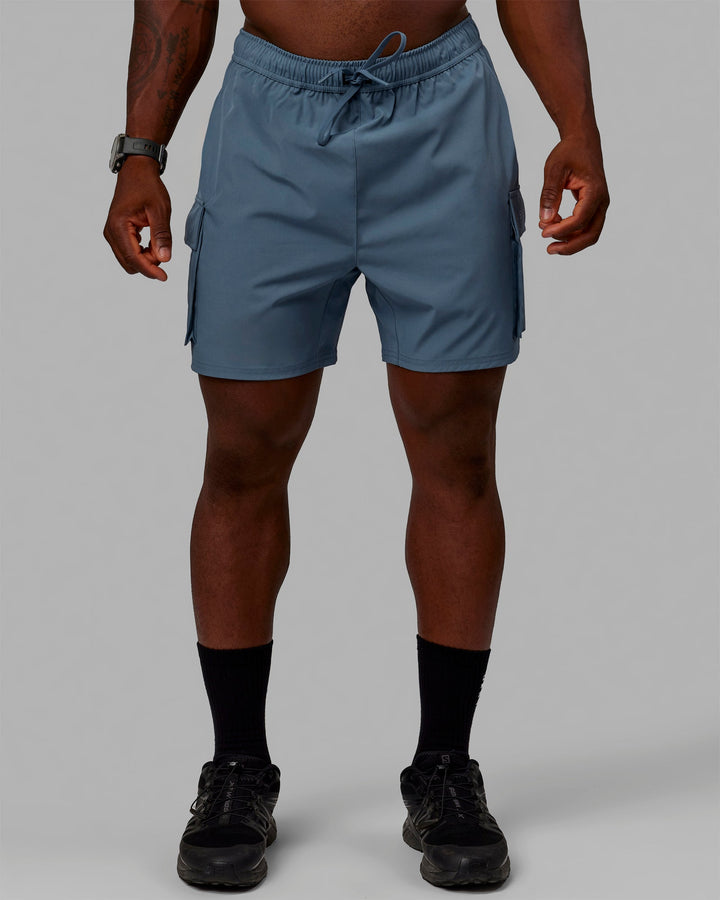 Man wearing Energy Stretch Performance Cargo Shorts - Storm
