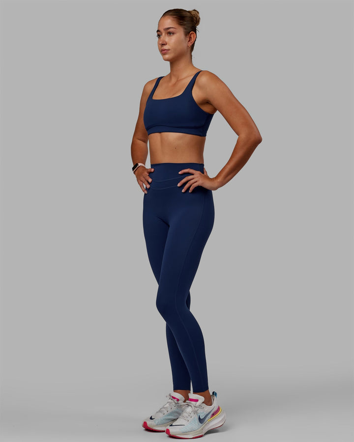 Woman wearing Enhance Full Length Leggings - Midnight Blue
