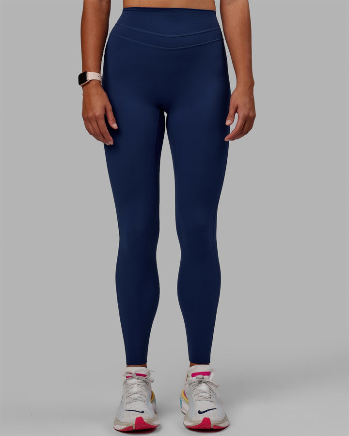 Woman wearing Enhance Full Length Leggings - Midnight Blue
