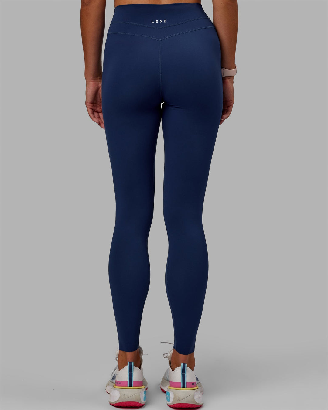 Woman wearing Enhance Full Length Leggings - Midnight Blue