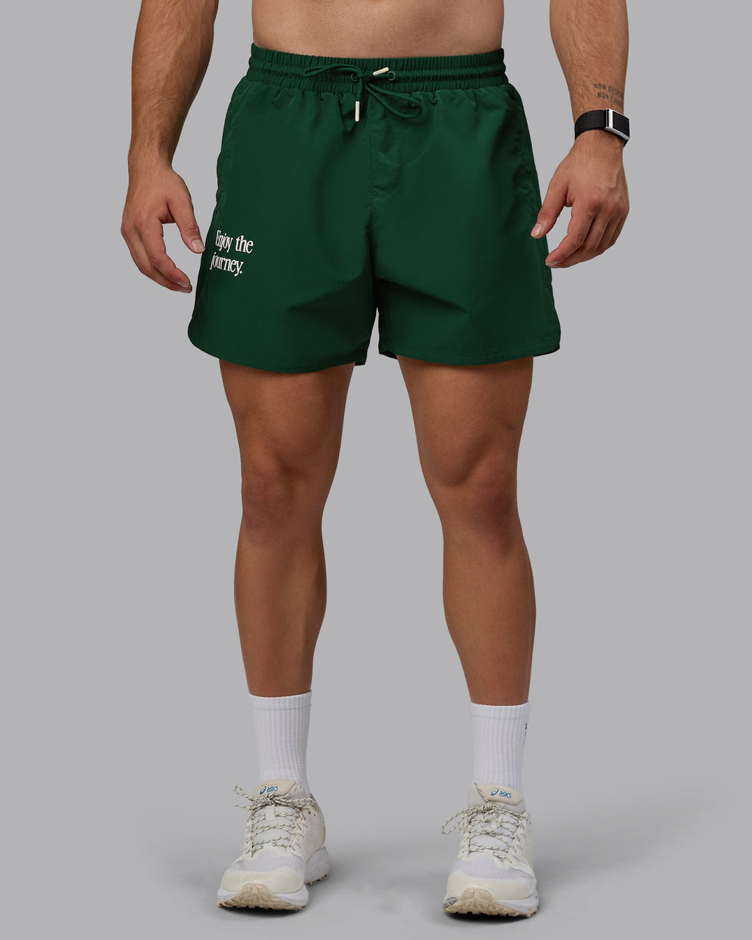 Man wearing Enjoy The Journey 5" Shorts - Deep Emerald-Off White