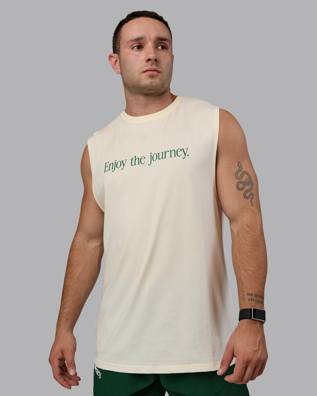 Man wearing Enjoy The Journey FLXCotton Tank - Off White-Deep Emerald