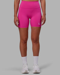 Woman wearing Evolved Ultra High-Rise 6" Short - Fuchsia Pink-White