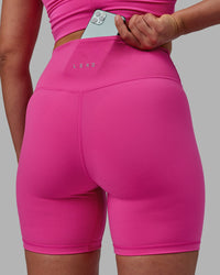 Woman wearing Evolved Ultra High-Rise 6" Short - Fuchsia Pink-White
