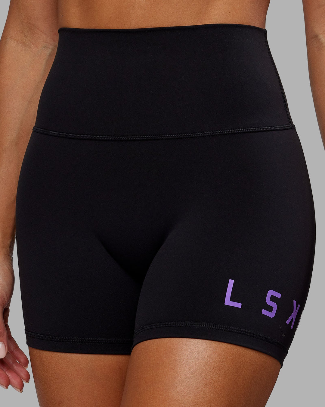 Woman wearing Evolved X-Length Shorts - Black-Purple Swirl