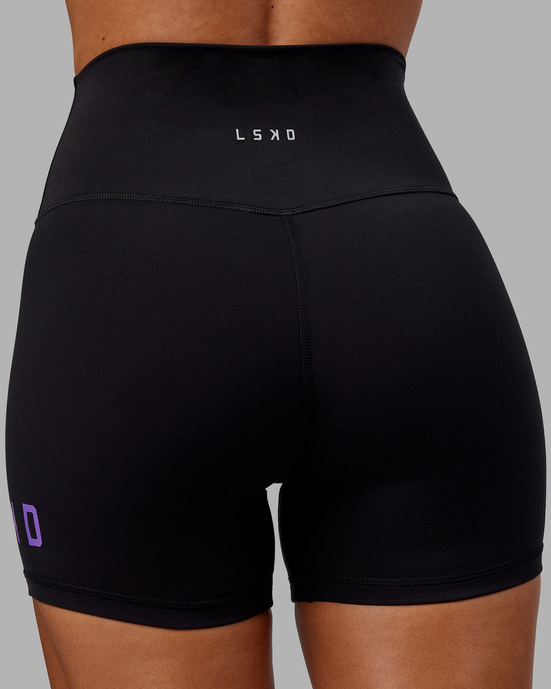 Woman wearing Evolved X-Length Shorts - Black-Purple Swirl