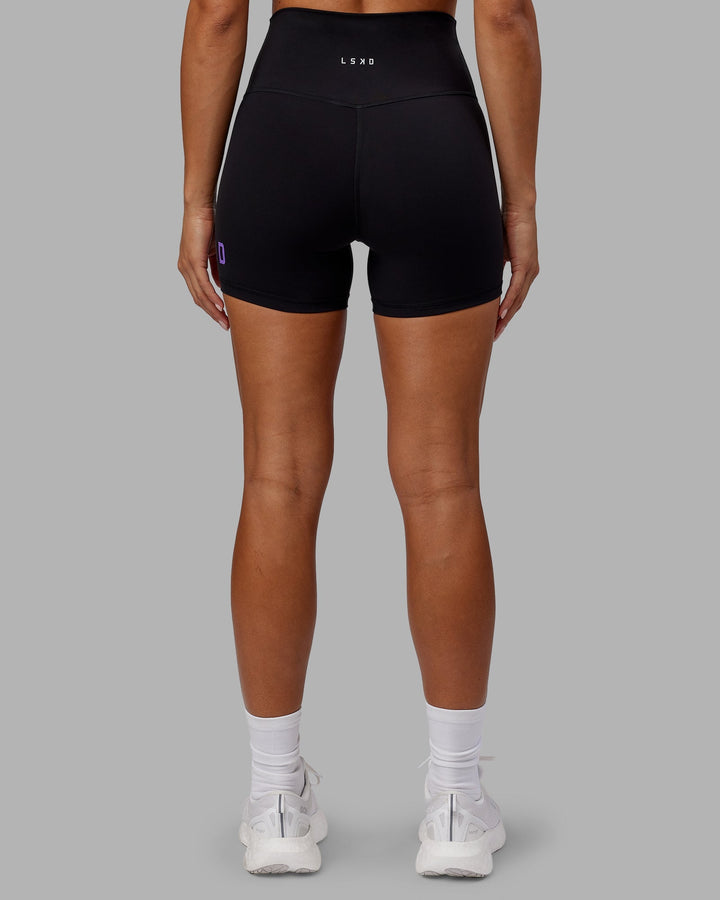 Woman wearing Evolved X-Length Shorts - Black-Purple Swirl
