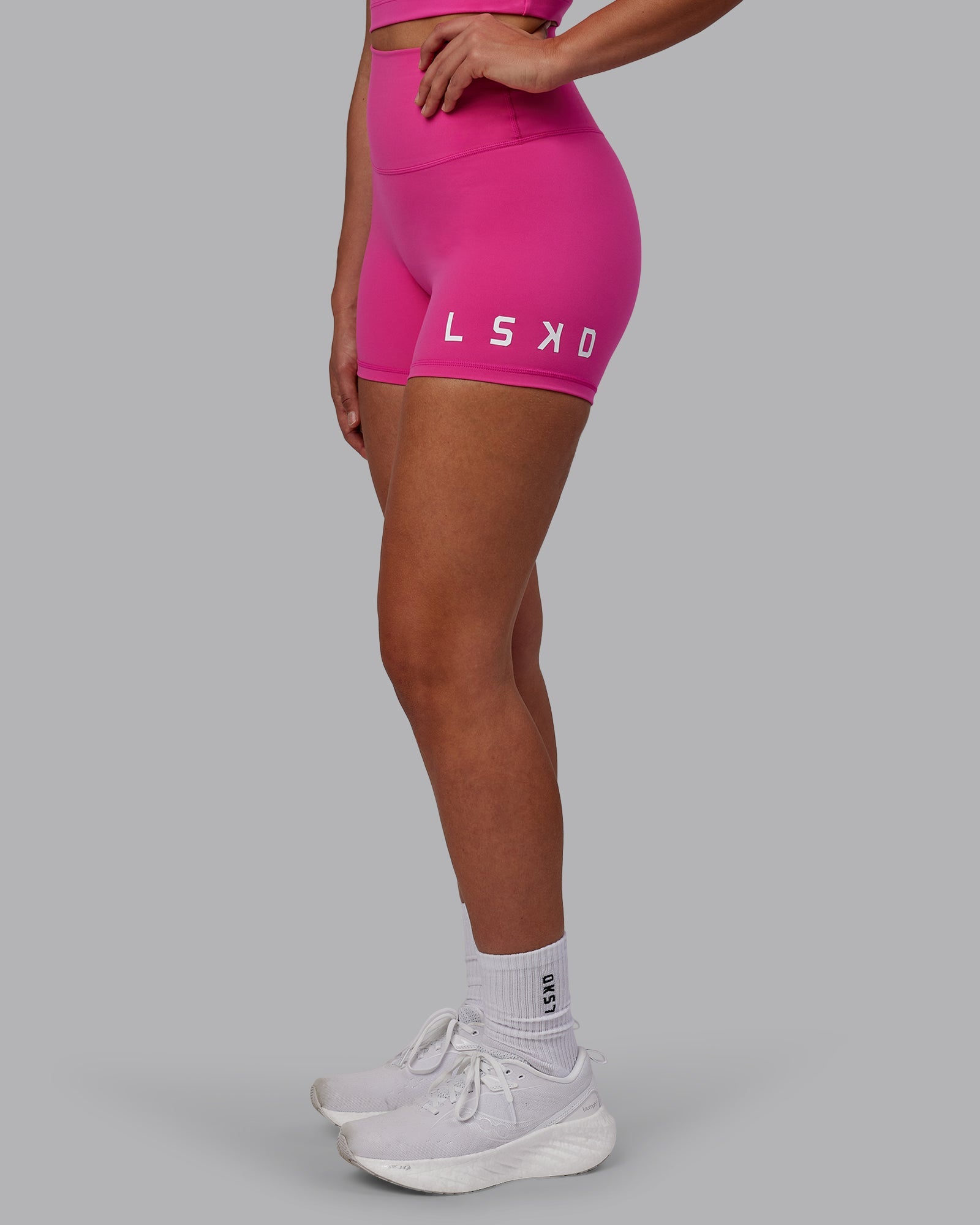 Woman wearing Evolved Ultra High-Rise 4" Short - Fuchsia Pink-White