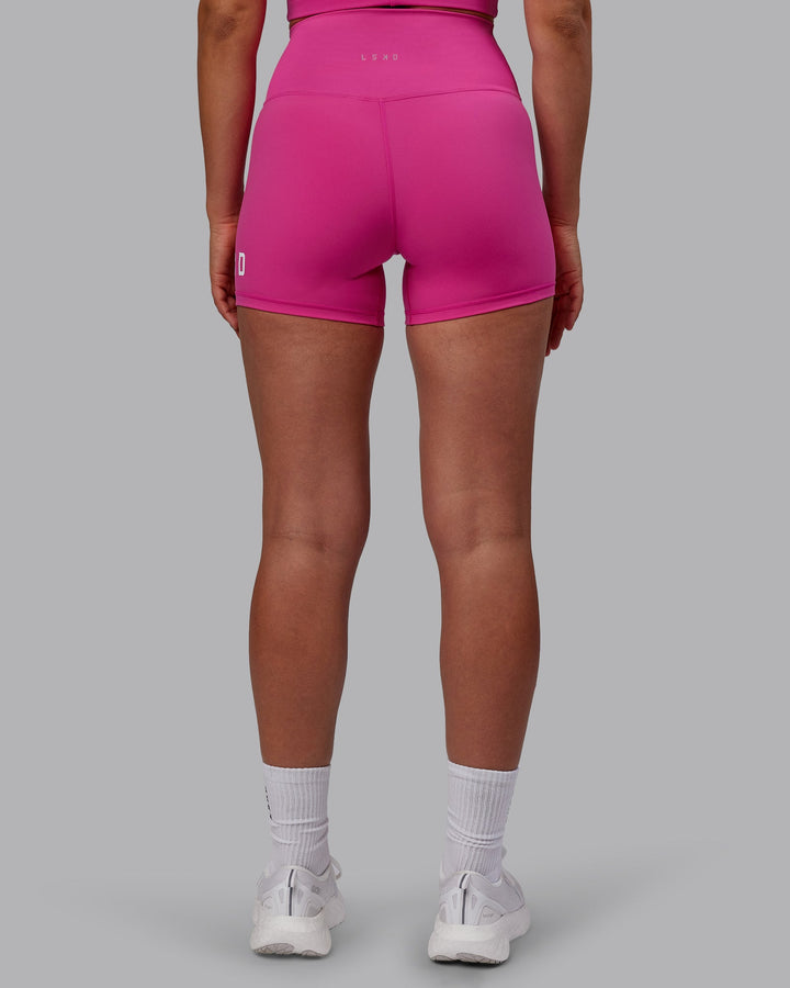 Woman wearing Evolved X-Short Tights - Fuchsia Pink-White
