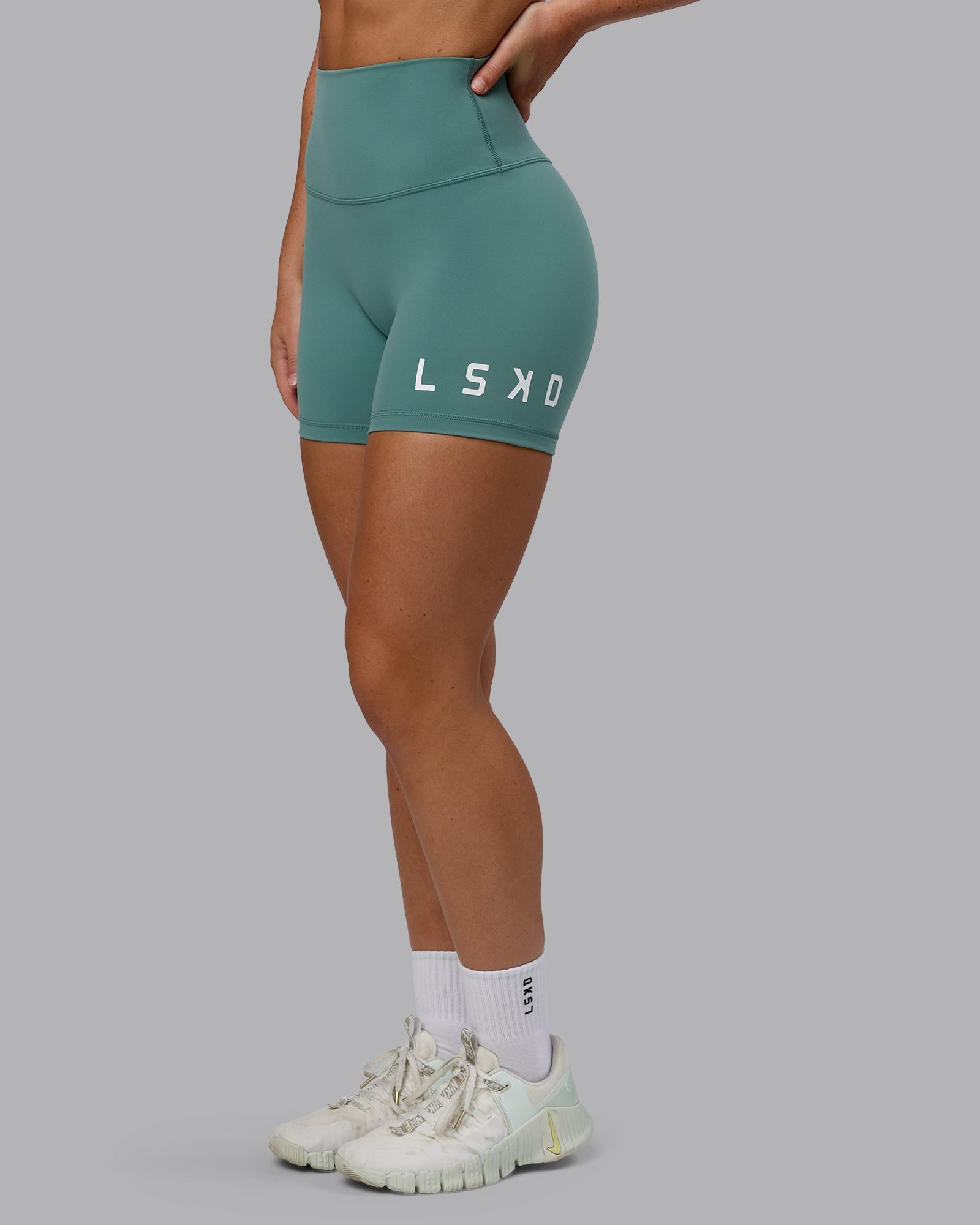 Woman wearing Evolved Ultra High-Rise 4" Short - Sagebrush-White