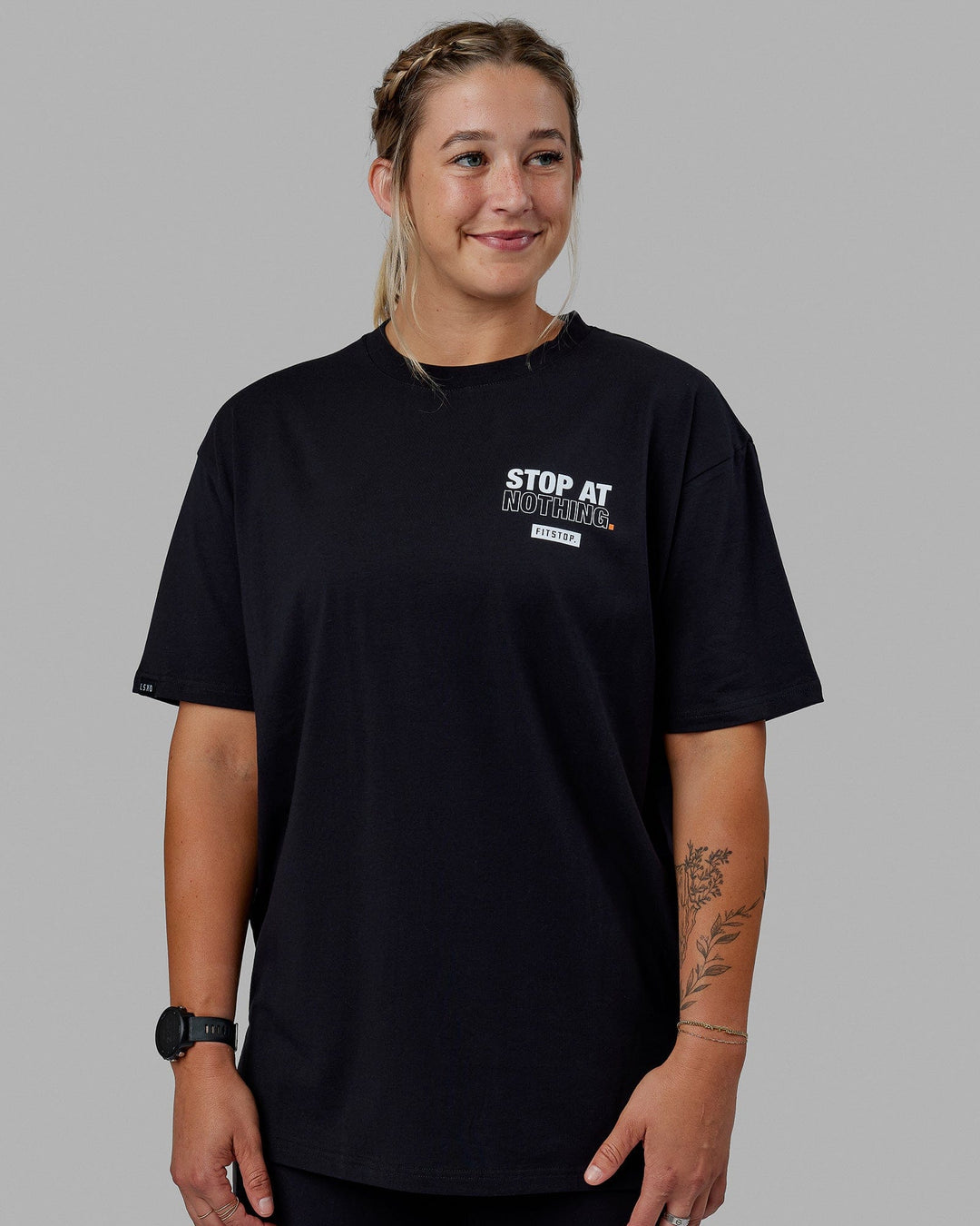 Woman wearing Unisex Fitstop Stop at Nothing Tee Oversize - Black-White