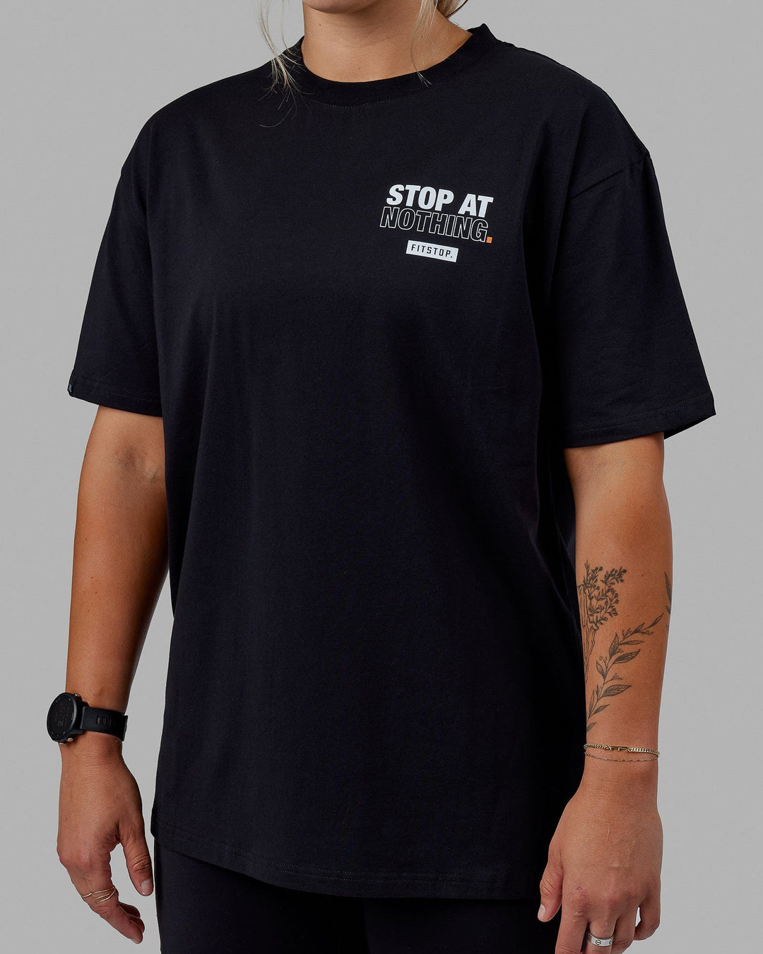 Woman wearing Unisex Fitstop Stop at Nothing Tee Oversize - Black-White