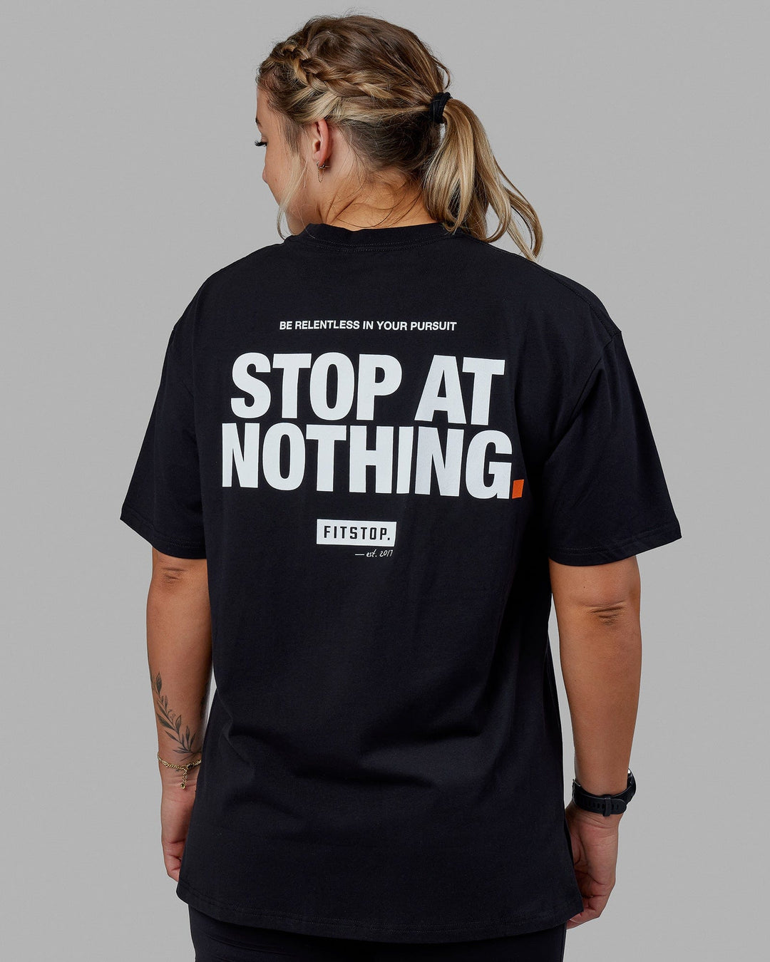 Woman wearing Unisex Fitstop Stop at Nothing Tee Oversize - Black-White