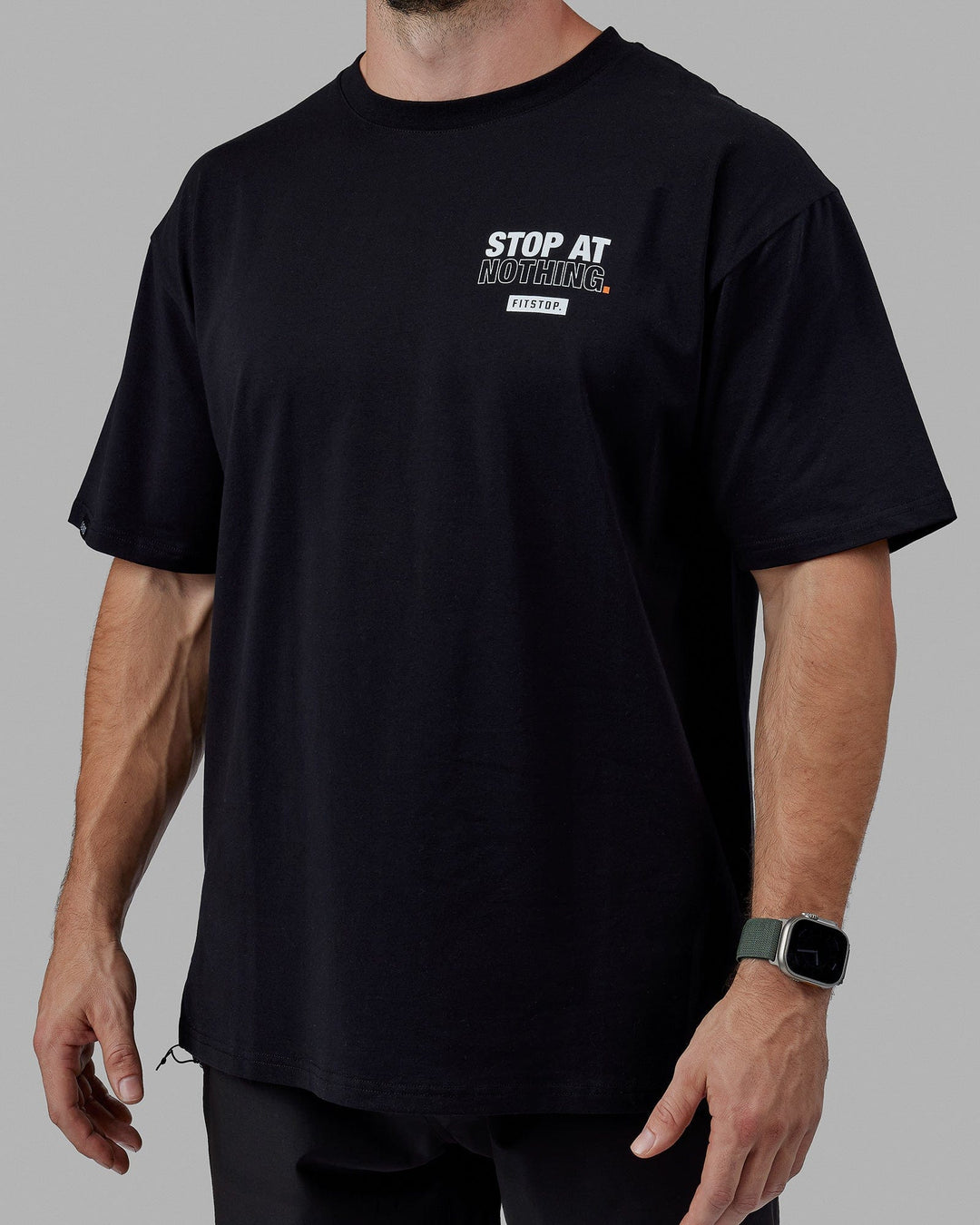 Man wearing Unisex Fitstop Stop at Nothing Tee Oversize - Black-White