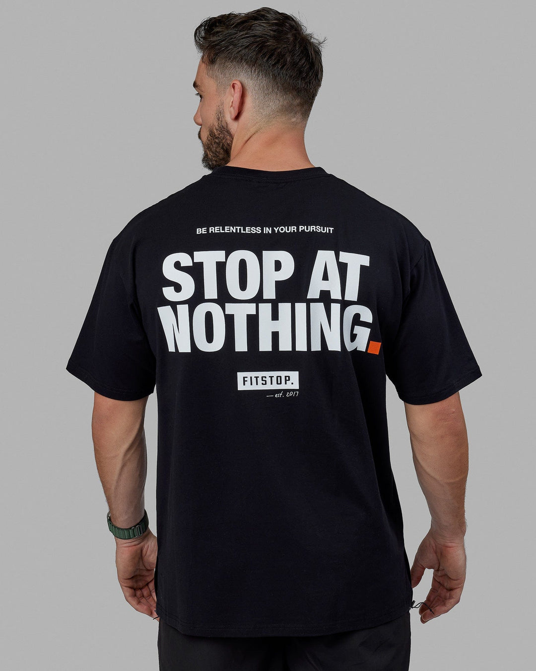 Man wearing Unisex Fitstop Stop at Nothing Tee Oversize - Black-White