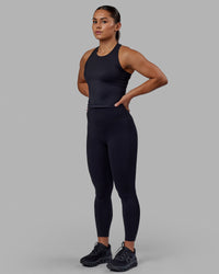 Woman wearing Flow Performance Tank - Black | Model:Xantheia | Size:S