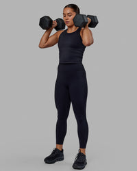 Woman wearing Flow Performance Tank - Black | Model:Xantheia | Size:S