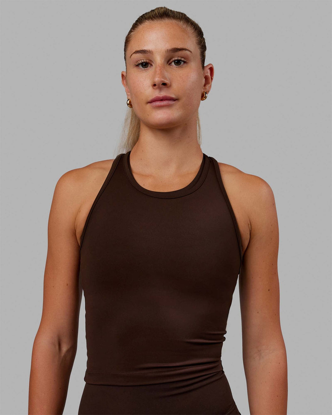 Woman wearing Flow Racerback Tank - Dark Chocolate