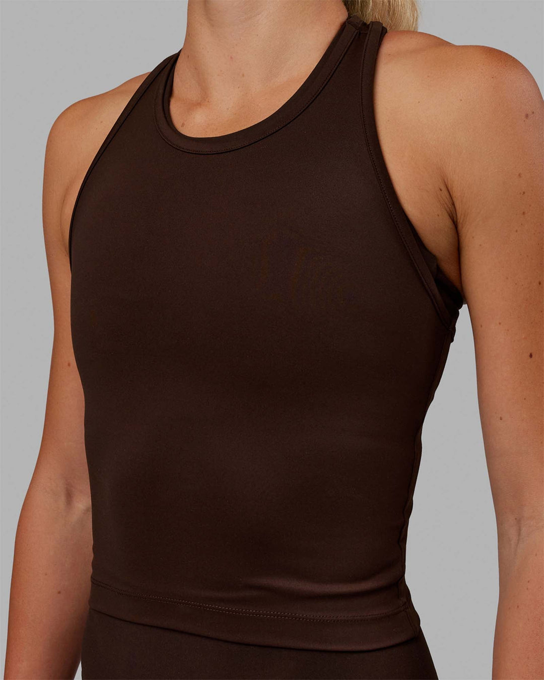 Woman wearing Flow Racerback Tank - Dark Chocolate