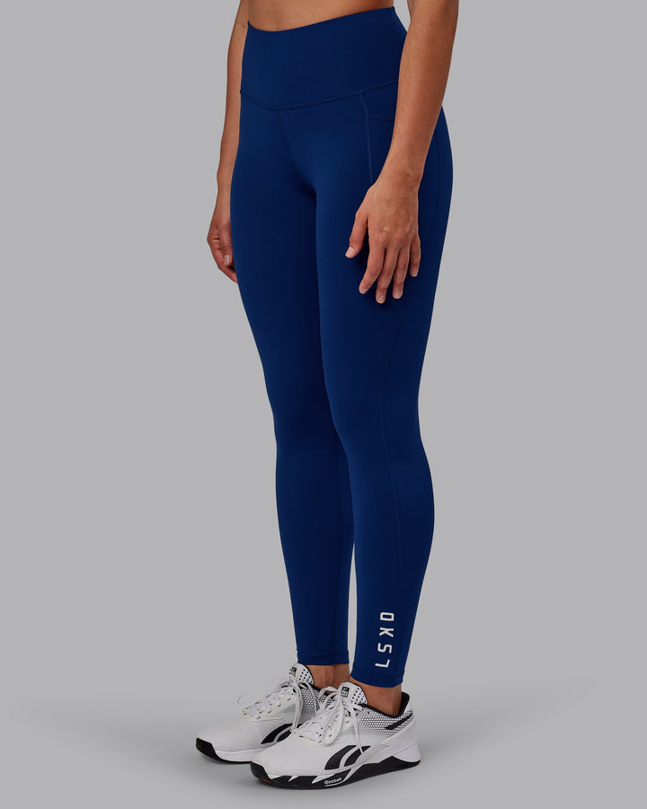 Woman wearing Flux Full Length Leggings - Midnight Blue
