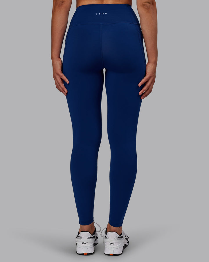 Woman wearing Flux Full Length Leggings - Midnight Blue
