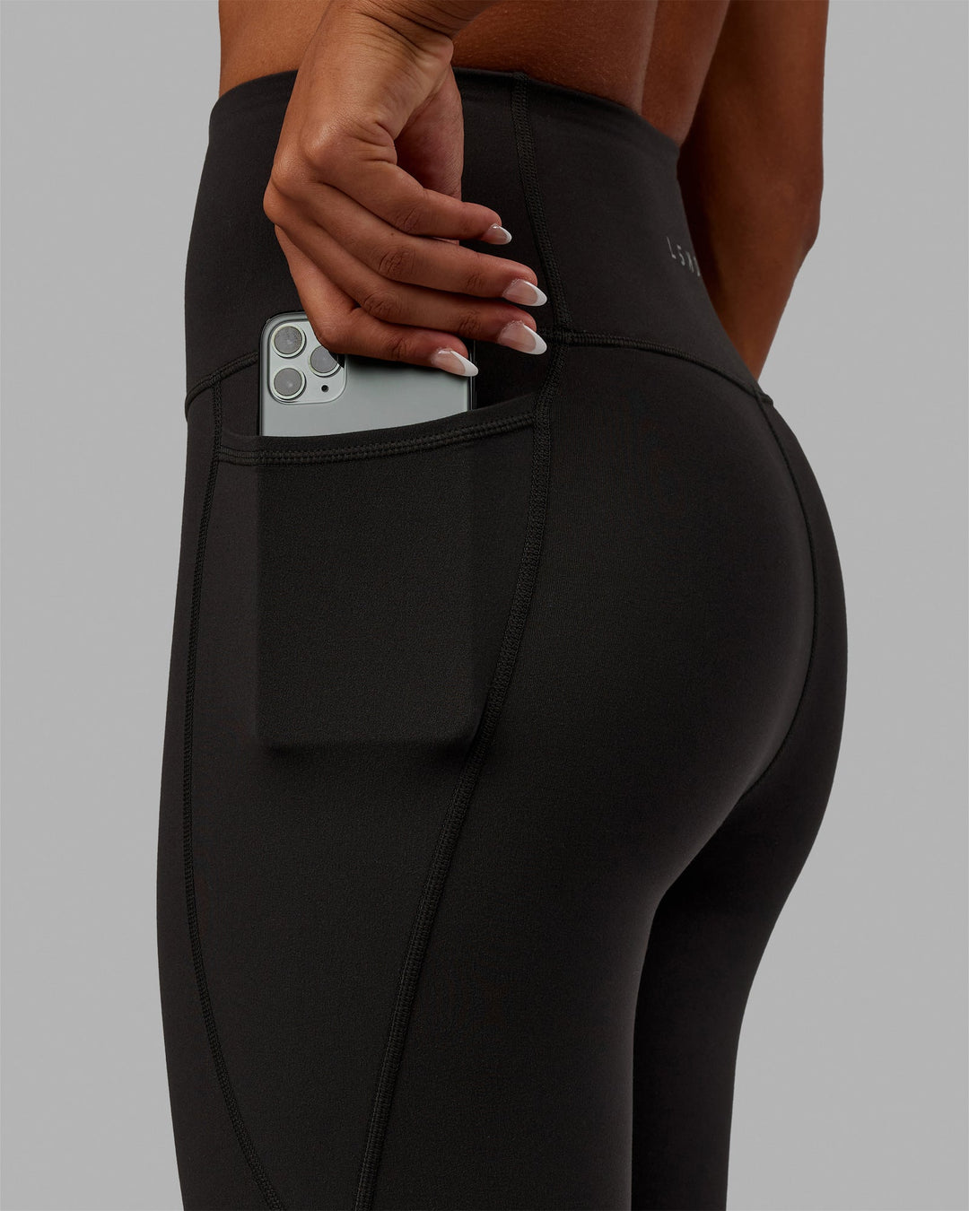 Woman wearing Flux Full Length Leggings - Pirate Black