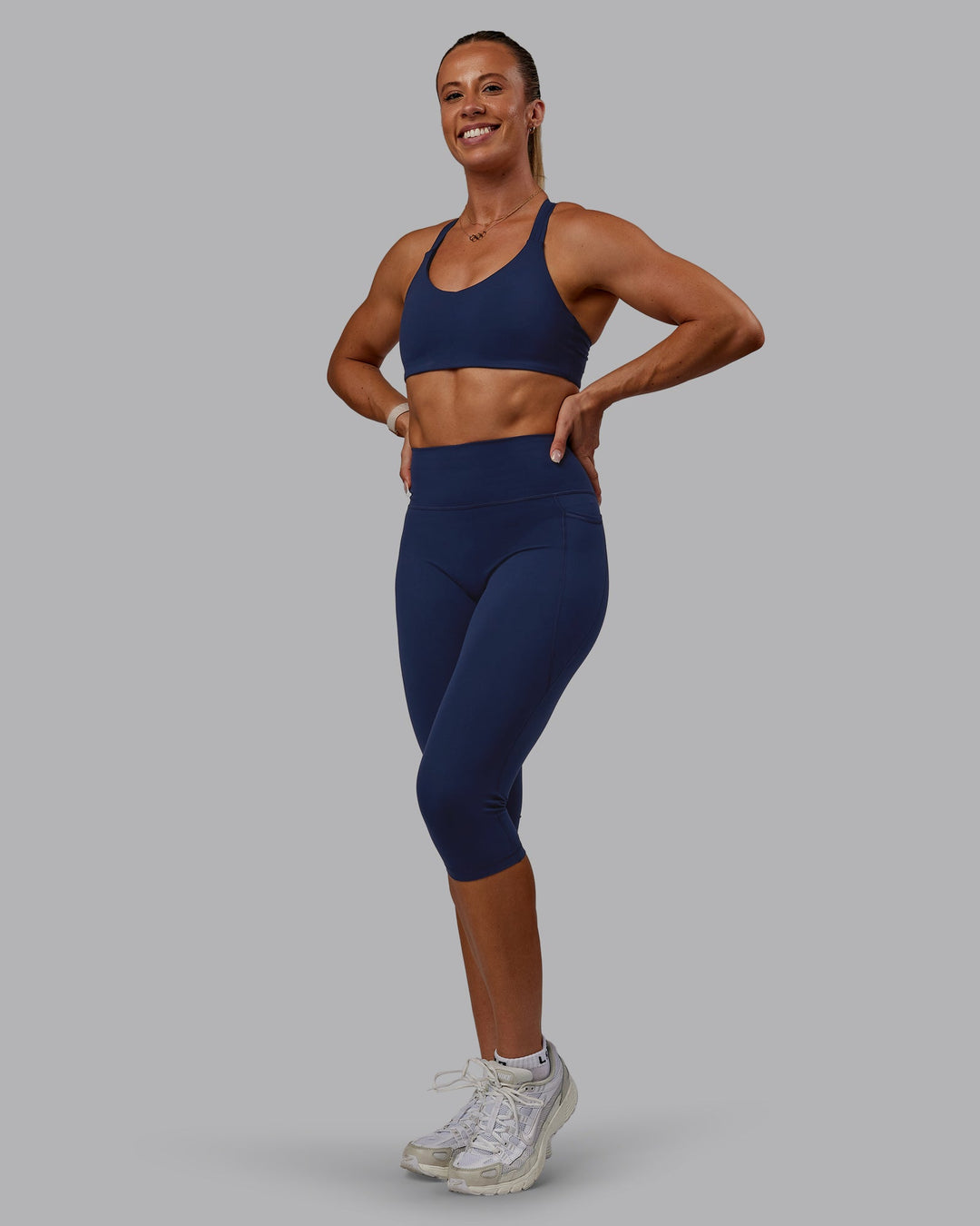 Woman wearing Fusion Ultra High-Rise 3/4 Legging Pockets - Future Navy | Model:Bree | Size:S