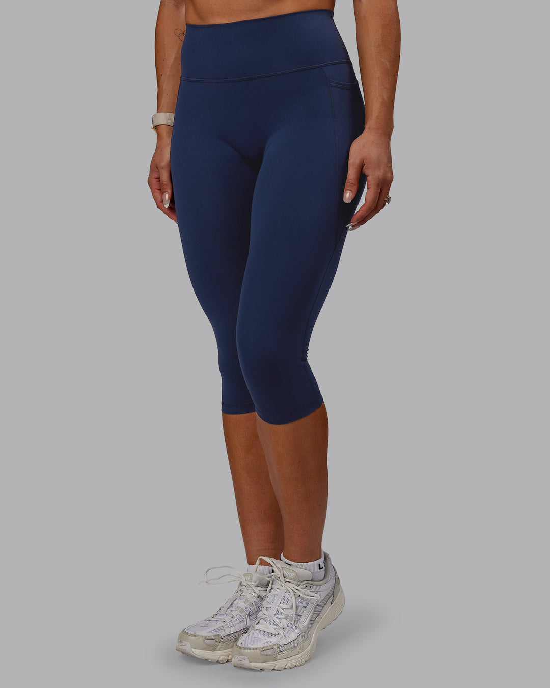 Woman wearing Fusion Ultra High-Rise 3/4 Legging Pockets - Future Navy | Model:Bree | Size:S