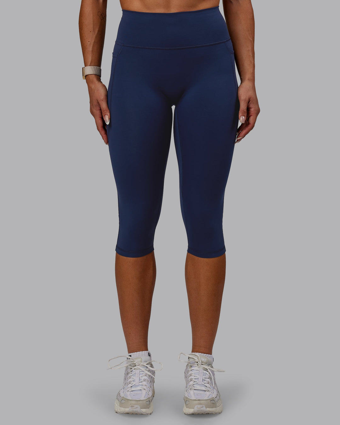 Woman wearing Fusion Ultra High-Rise 3/4 Legging Pockets - Future Navy | Model:Bree | Size:S