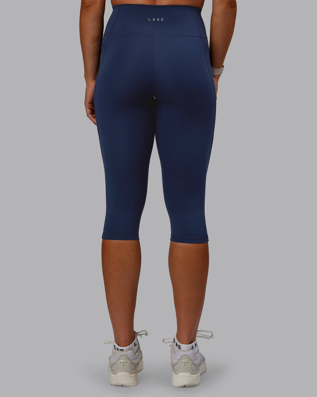 Woman wearing Fusion Ultra High-Rise 3/4 Legging Pockets - Future Navy | Model:Bree | Size:S