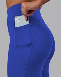 Woman wearing Fusion Ultra High-Rise 7/8 Legging Pockets - Power Cobalt | Model:Hannah | Size:S