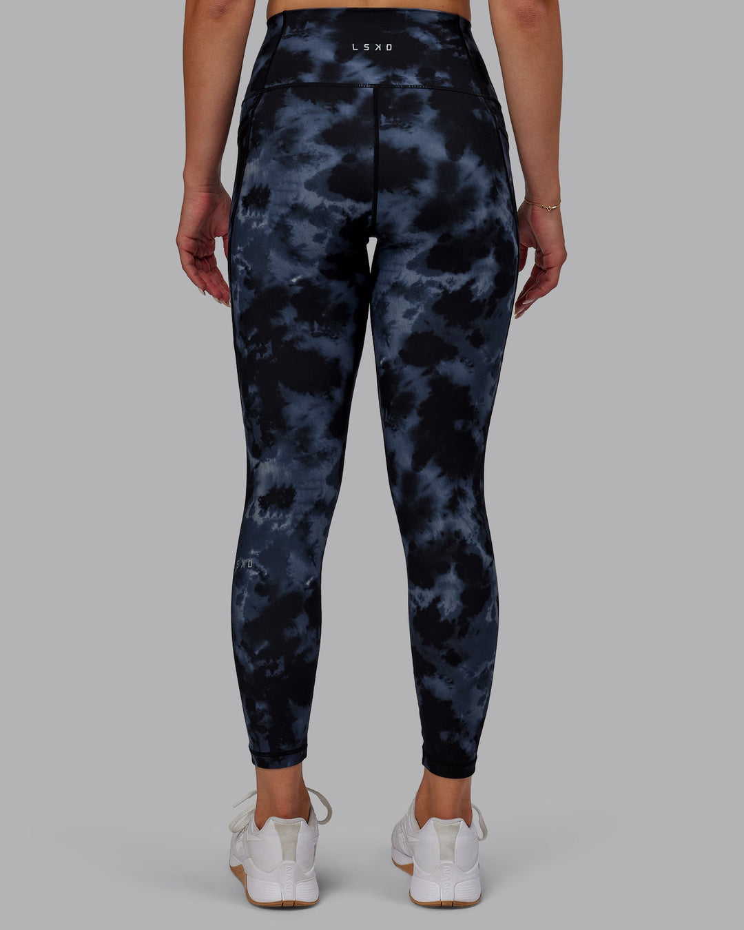 Woman wearing Fusion 7/8 Length Leggings - Tie Dye-Midnight