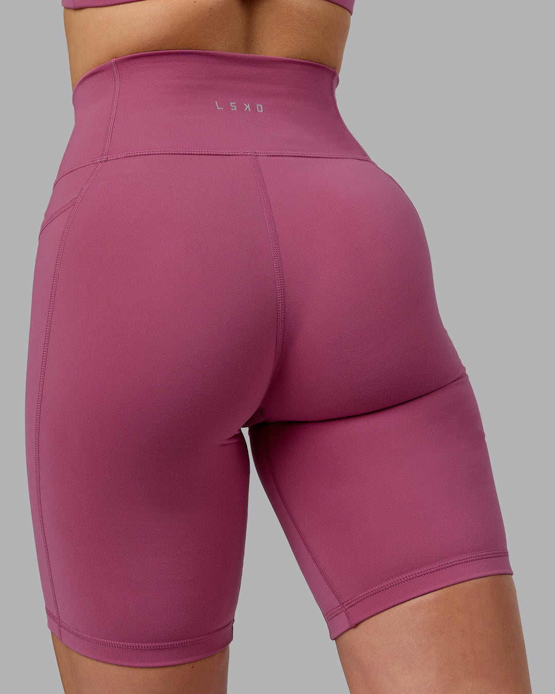 Woman wearing Fusion Bike Shorts with Pockets - Mauve Haze