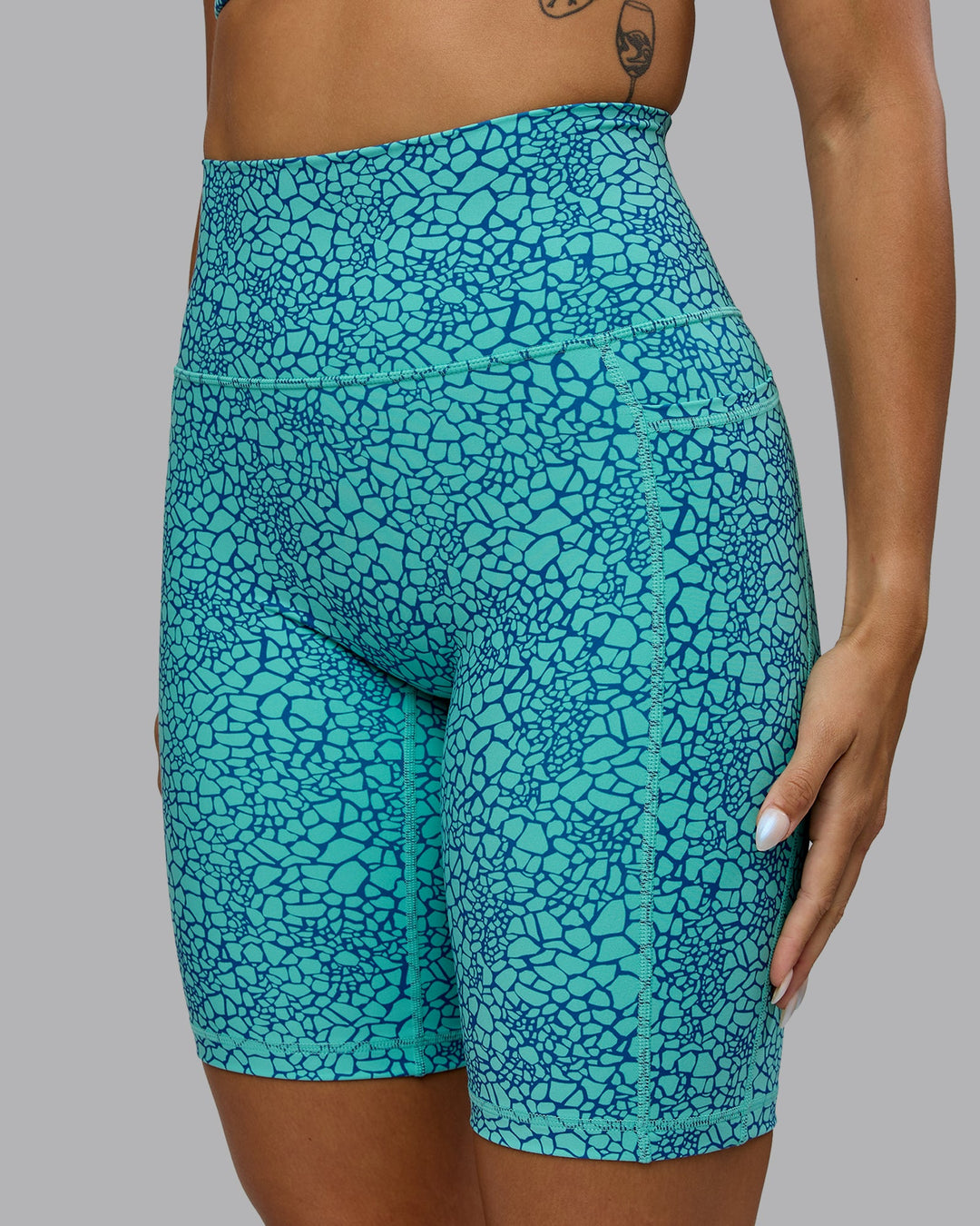 Woman wearing Fusion Bike Shorts - Aquatic Awe Vitality Print