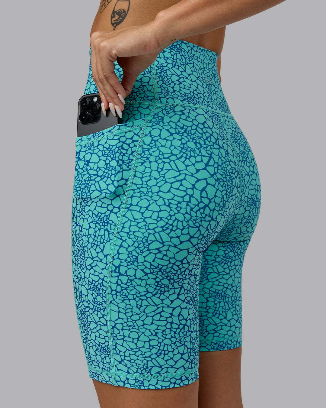 Woman wearing Fusion Bike Shorts - Aquatic Awe Vitality Print