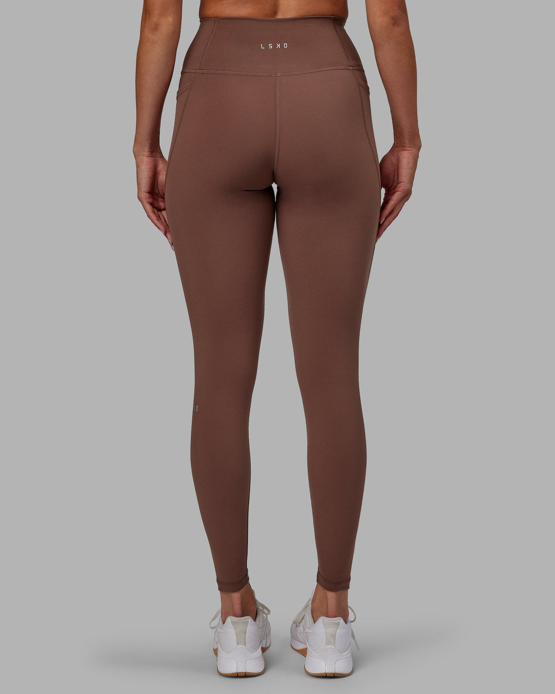 Woman wearing Fusion Full Length Leggings - Dull Rust