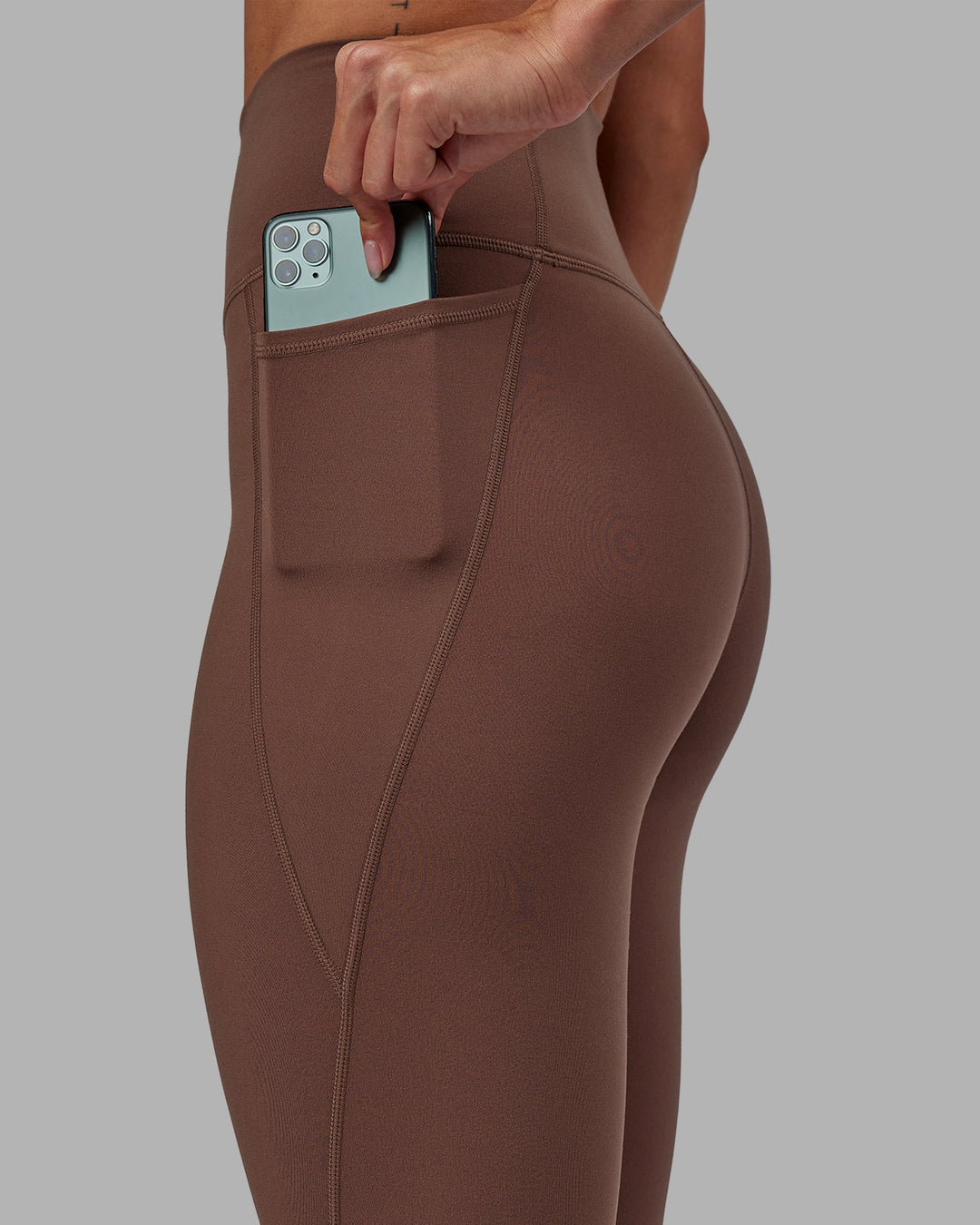 Woman wearing Fusion Full Length Leggings - Dull Rust