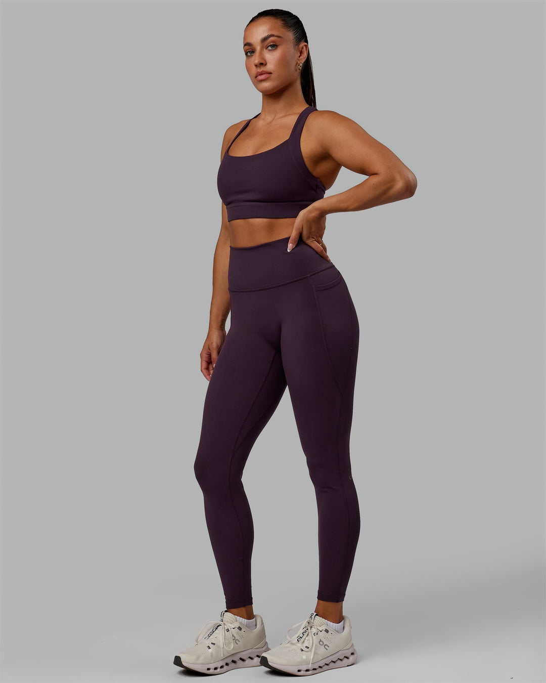 Woman wearing Fusion Ultra High-Rise Full Length Legging Pockets - Midnight Plum | Model:Gabby | Size:S