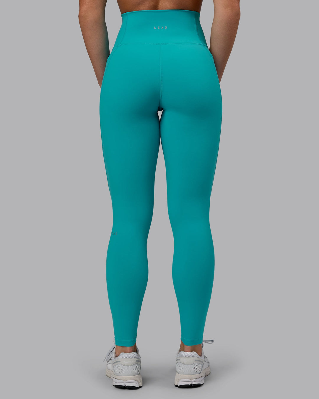 Woman wearing Fusion Ultra High-Rise Full Length Legging Pockets - Uplift Blue | Model:Monique | Size:S
