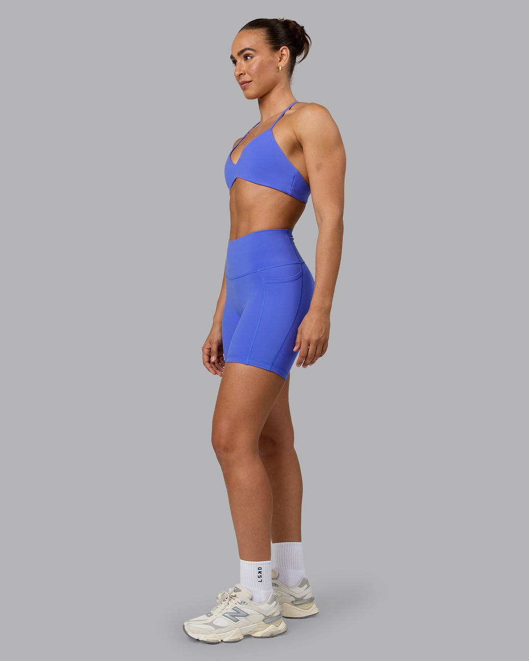 Woman wearing Fusion Mid Short Tights with Pockets - Baja Blue