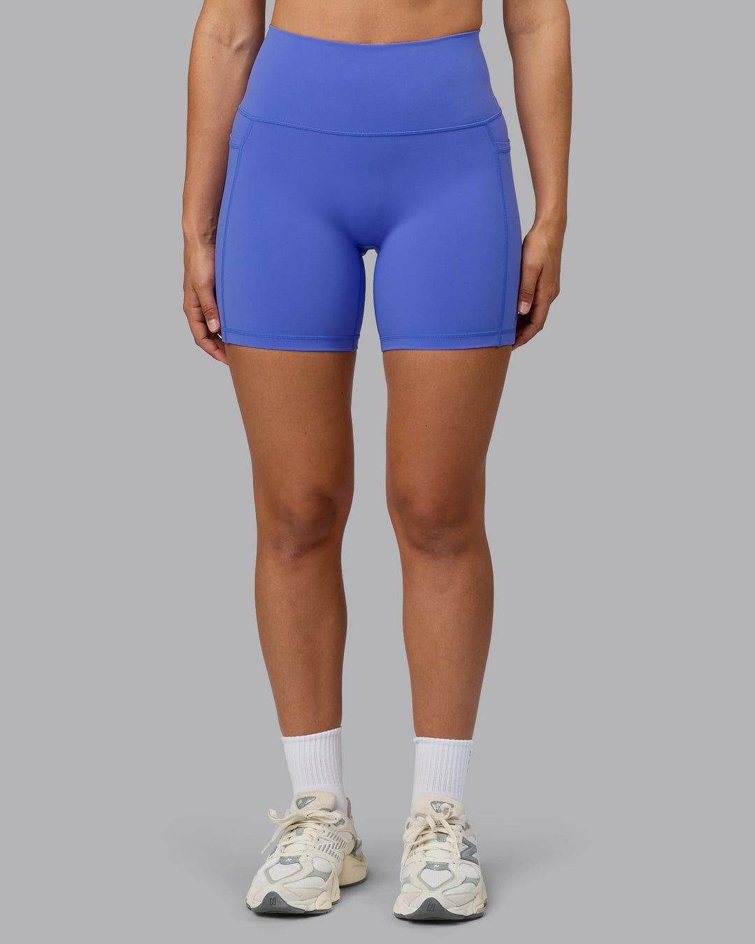 Woman wearing Fusion Ultra High-Rise 6&quot; Short Pockets - Baja Blue | Model:Sophie | Size:S
