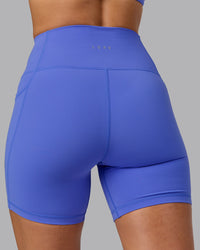 Woman wearing Fusion Ultra High-Rise 6" Short Pockets - Baja Blue | Model:Sophie | Size:S