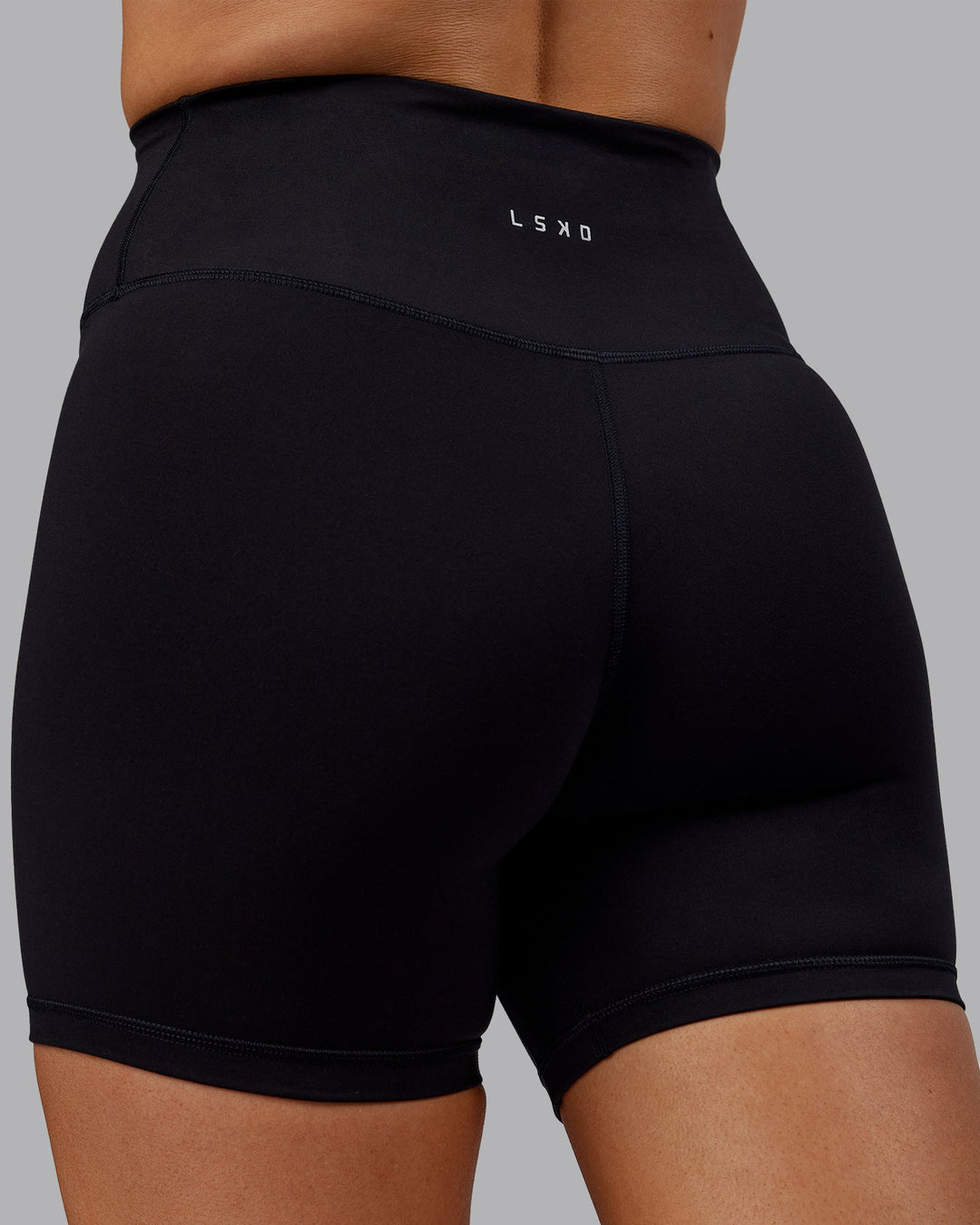 Woman wearing Fusion Mid Short Tights - Black No Pockets