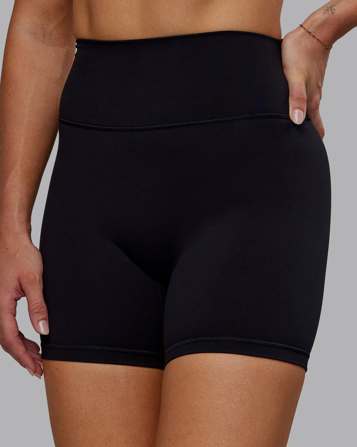 Woman wearing Fusion Mid Short Tights - Black No Pockets
