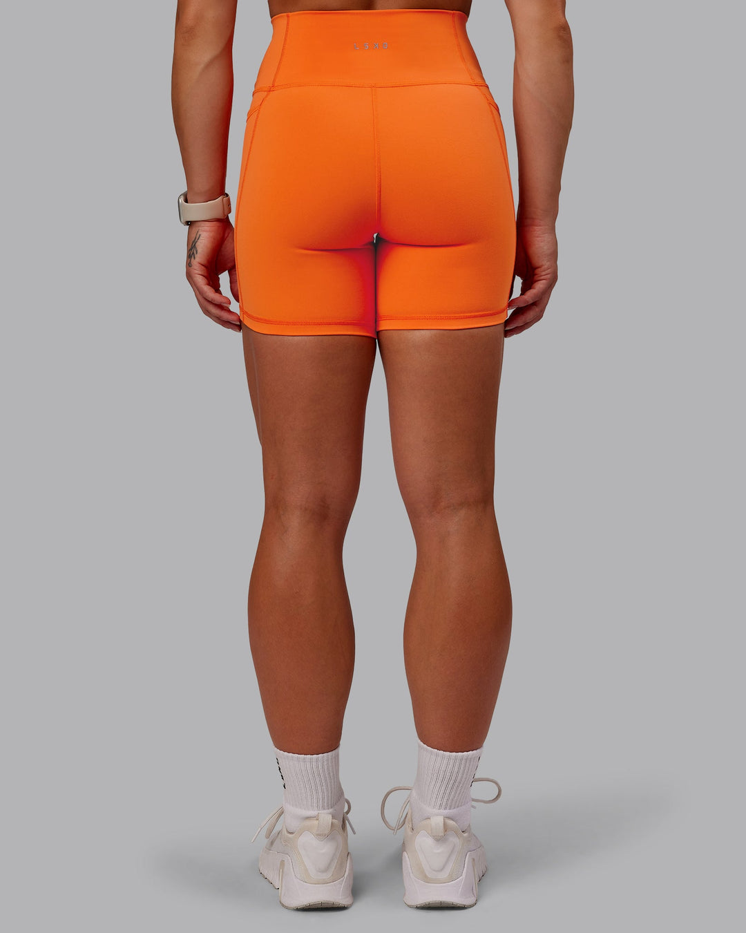 Woman wearing Fusion Mid Short Tights with Pockets - Mandarin